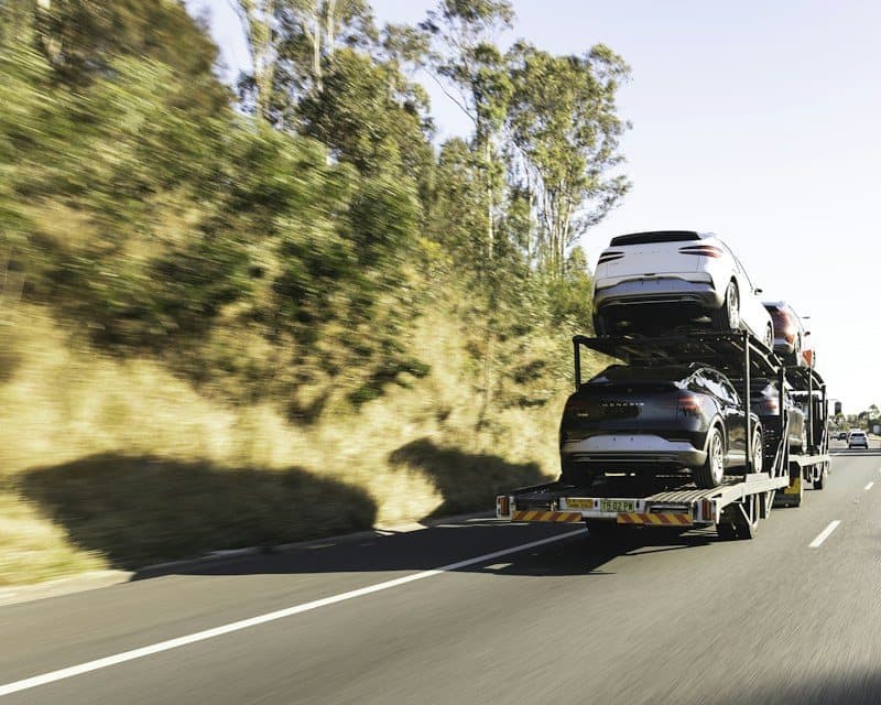 Car transporter carrying vehicles on the highway