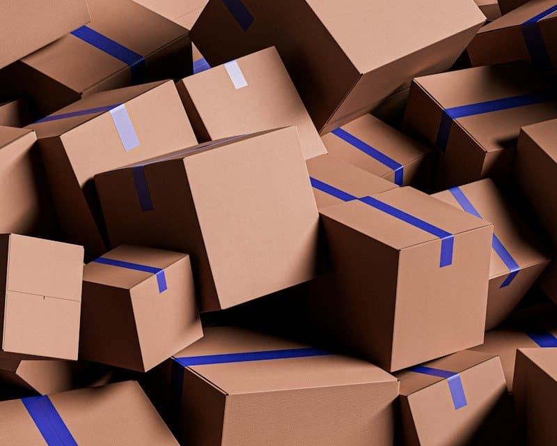Pile of sealed moving cartons ready for transport